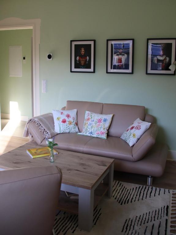 a living room with a couch and a coffee table at Felsenblick in Pforzheim