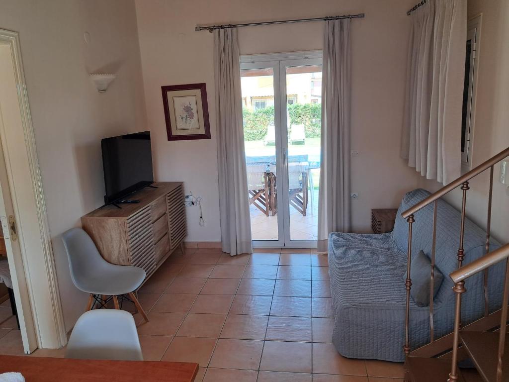 A television and/or entertainment centre at Villa Filia std