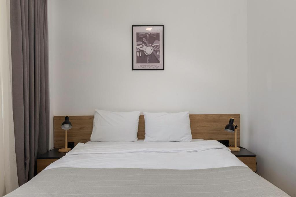 Postel nebo postele na pokoji v ubytování 3100 Boutique Hotel Kazbegi