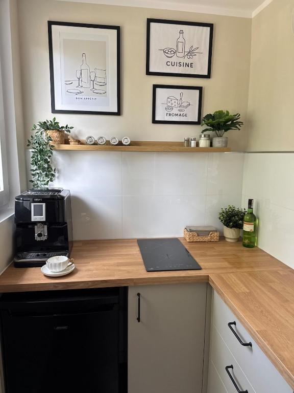 a kitchen with a counter with a microwave on it at Seaside Apartment in Gdańsk