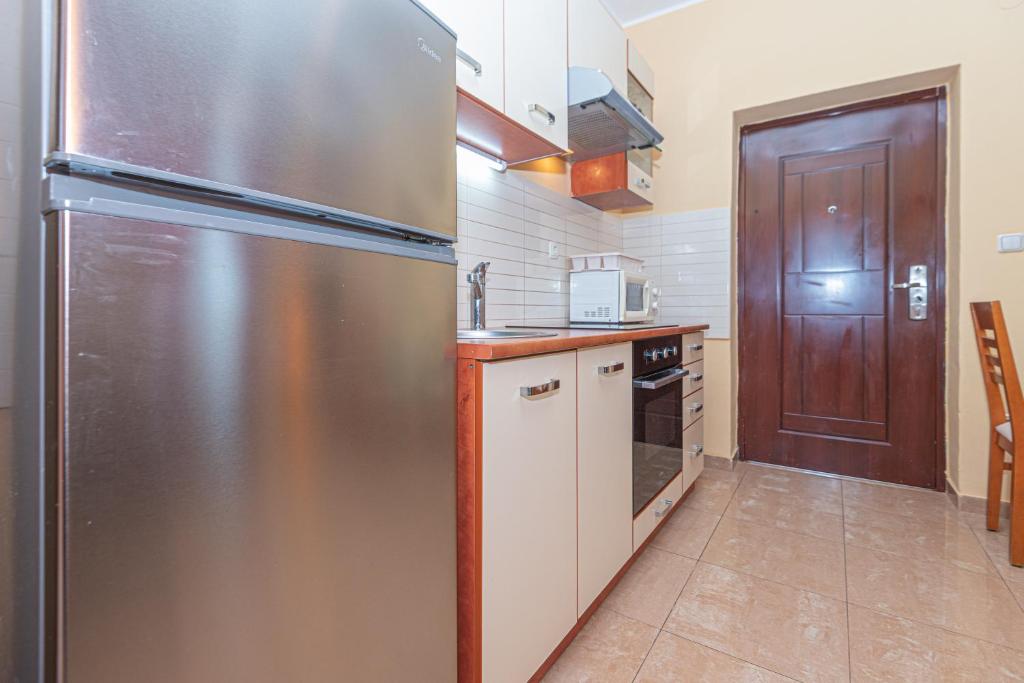 Kuchyňa alebo kuchynka v ubytovaní Apartments Burazer