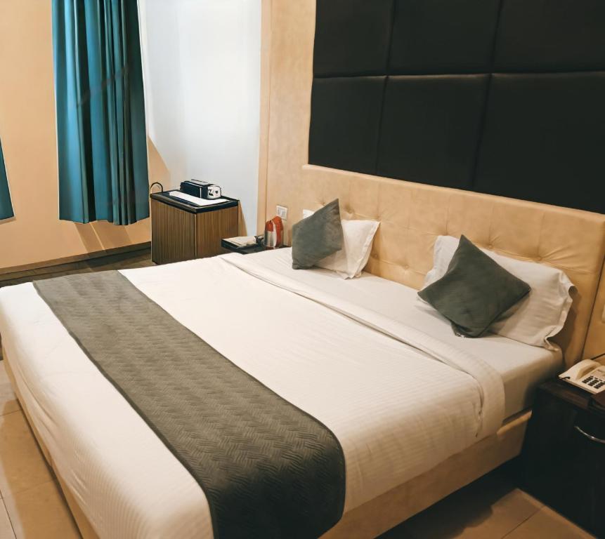 Postel nebo postele na pokoji v ubytování Hotel metroview