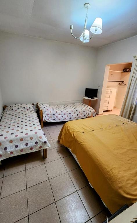 Ένα ή περισσότερα κρεβάτια σε δωμάτιο στο Lo de Luis