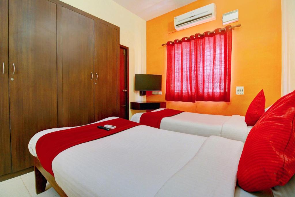Postel nebo postele na pokoji v ubytování Super Hotel O Infosys Thoraipakkam