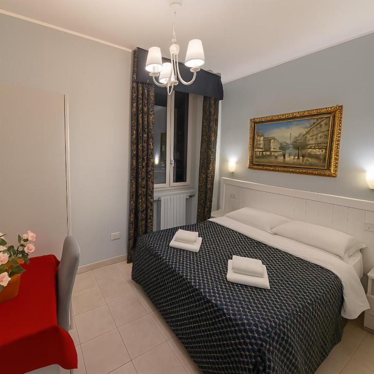 Postel nebo postele na pokoji v ubytování Hotel Aurelia Milano Centrale