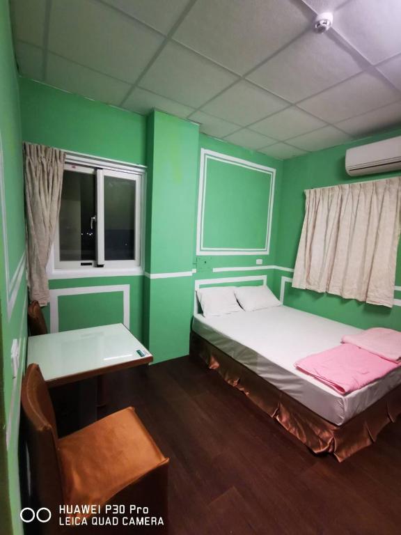 Postel nebo postele na pokoji v ubytování Lanyu Gulu Homestay