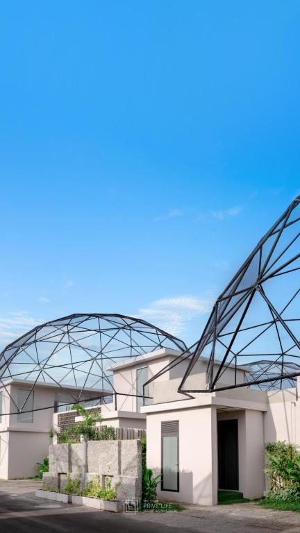 a large metal sculpture on the side of a building at Taradol Premium by Tukta in Hua Hin