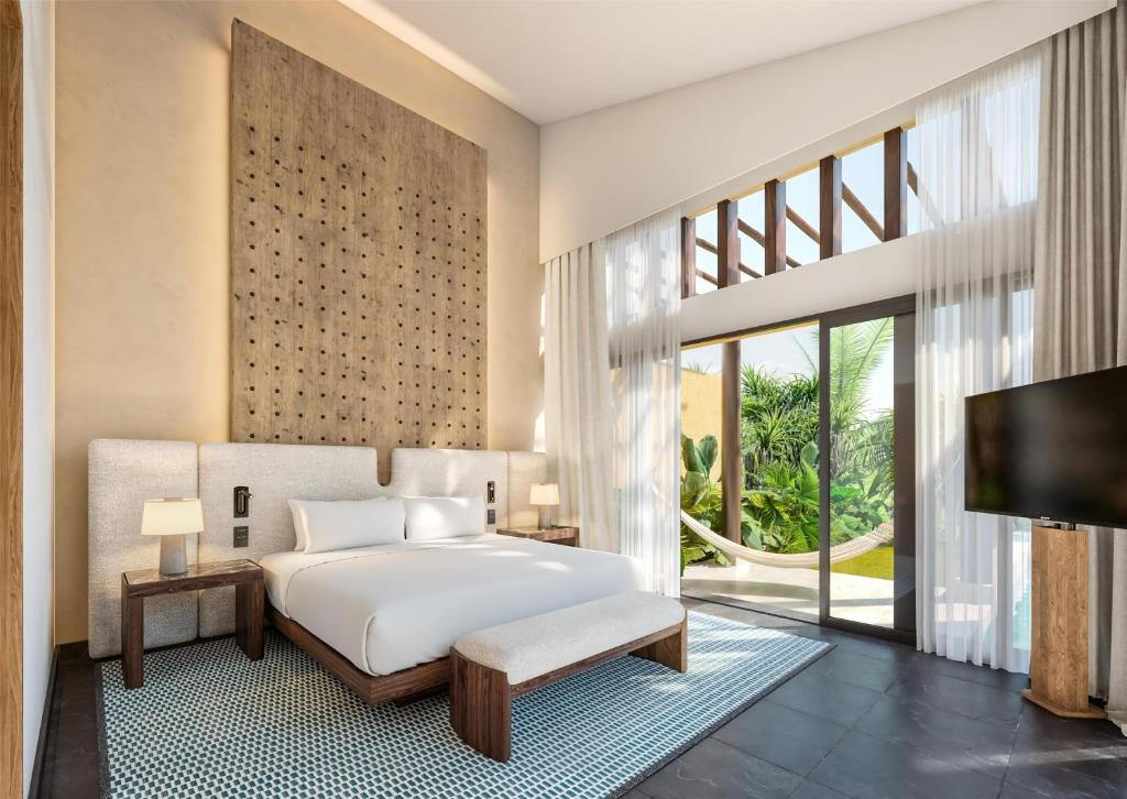 Postel nebo postele na pokoji v ubytování Banyan Tree Mayakoba