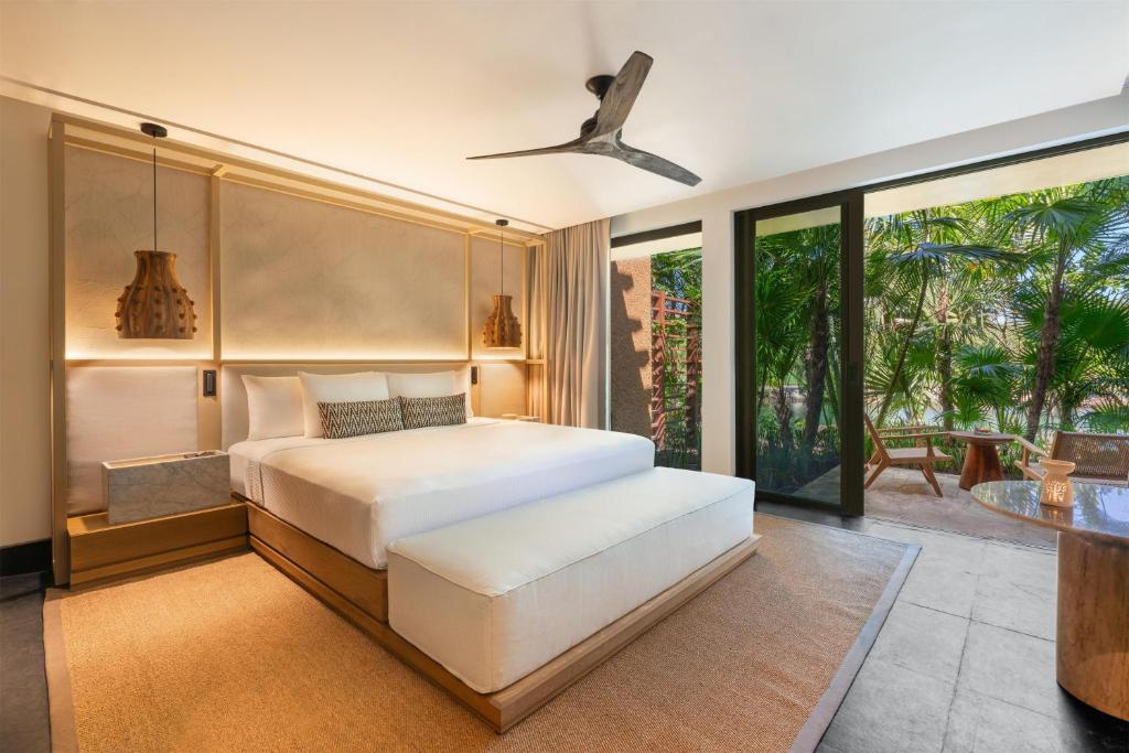 Postel nebo postele na pokoji v ubytování Banyan Tree Mayakoba