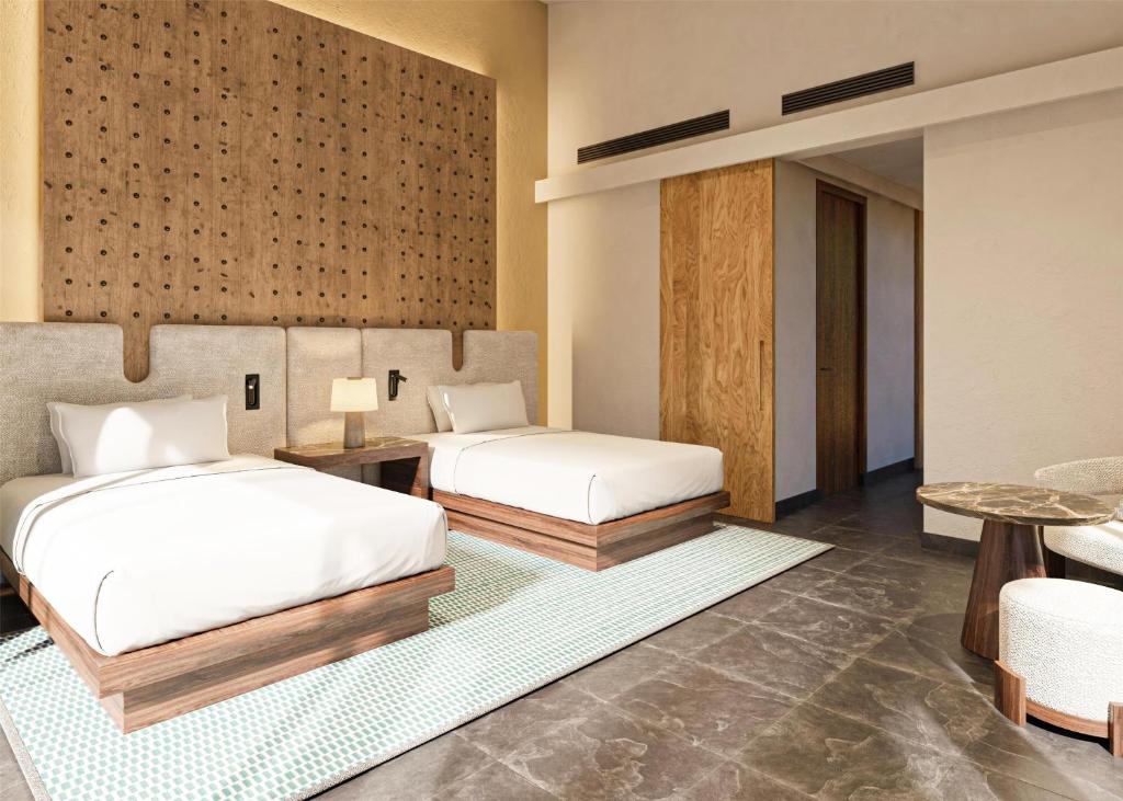Postel nebo postele na pokoji v ubytování Banyan Tree Mayakoba