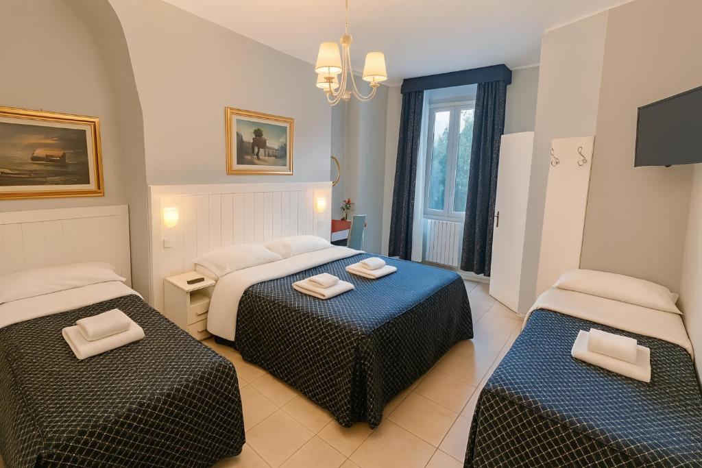 Postel nebo postele na pokoji v ubytování Hotel Aurelia Milano Centrale