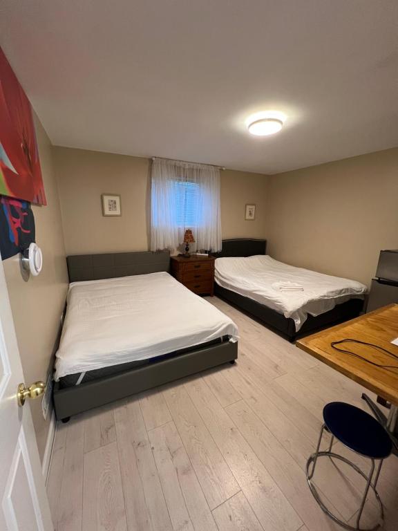 Postel nebo postele na pokoji v ubytování Brentwood Home