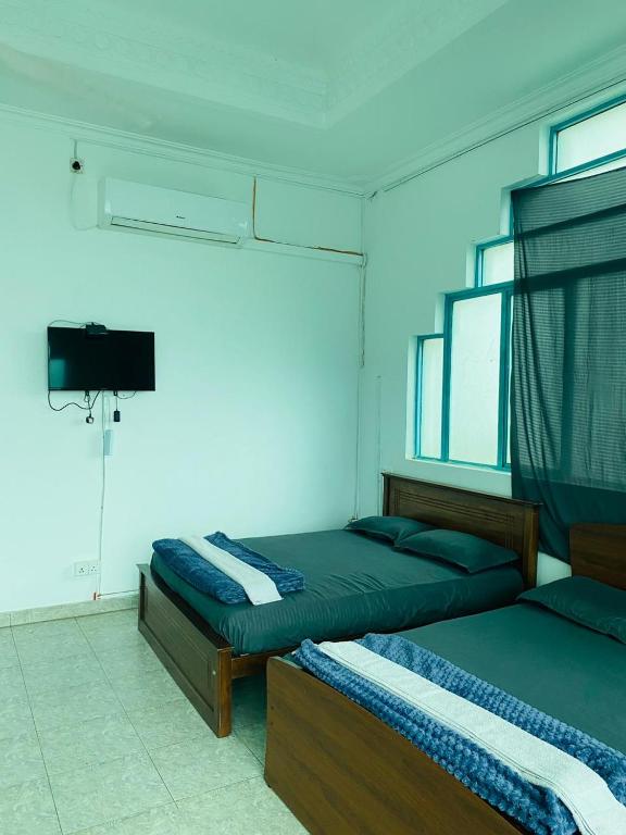Postel nebo postele na pokoji v ubytování Colombo Hotel