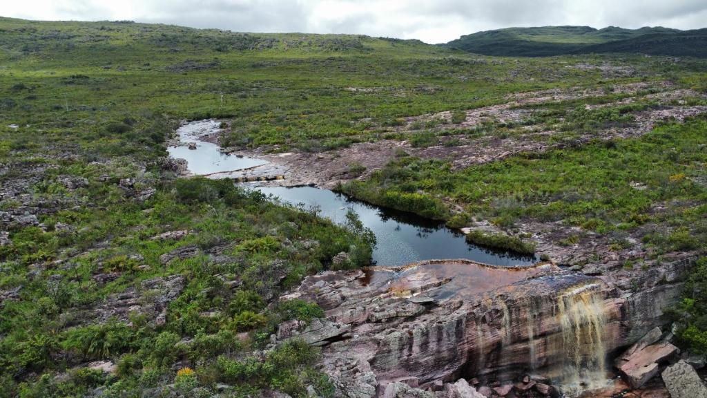 an aerial view of a river on a rocky hillside at Suite Aconchego in Mucugê