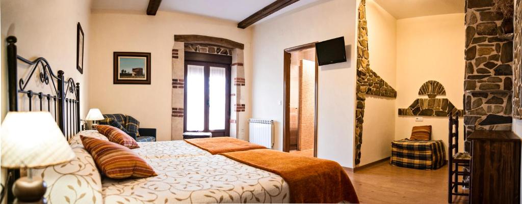 Cama o camas de una habitación en Hotel Rural El Habanero