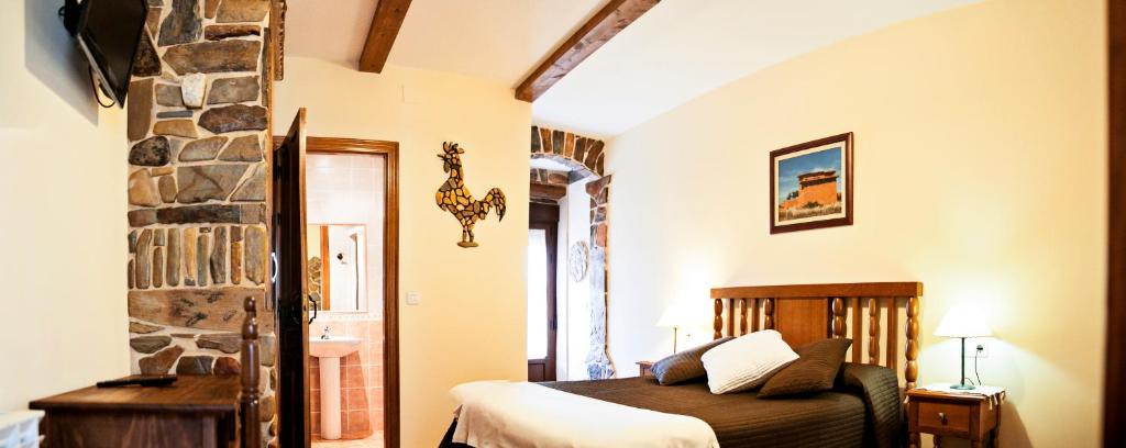 Cama o camas de una habitación en Hotel Rural El Habanero