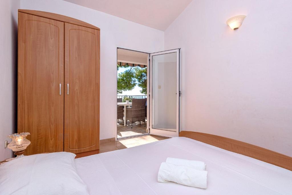 Postel nebo postele na pokoji v ubytování Apartments Zora