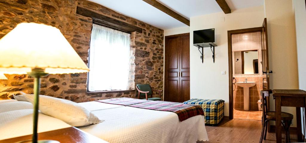 Cama o camas de una habitación en Hotel Rural El Habanero