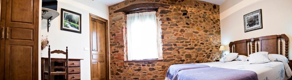 Cama o camas de una habitación en Hotel Rural El Habanero