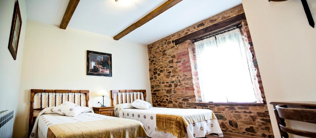 Cama o camas de una habitación en Hotel Rural El Habanero