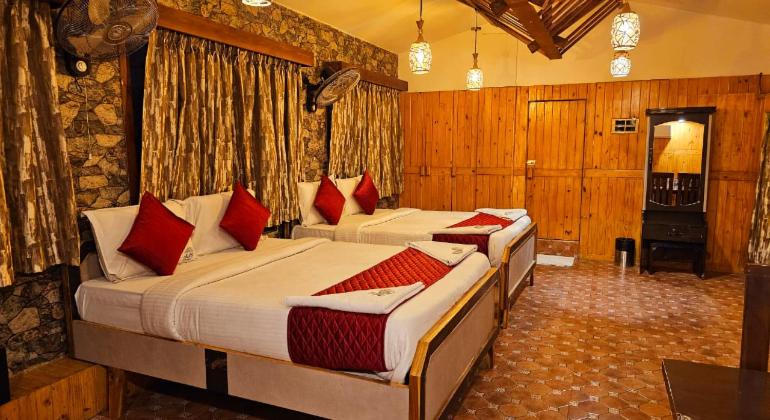 Postel nebo postele na pokoji v ubytování JJs PARK INN