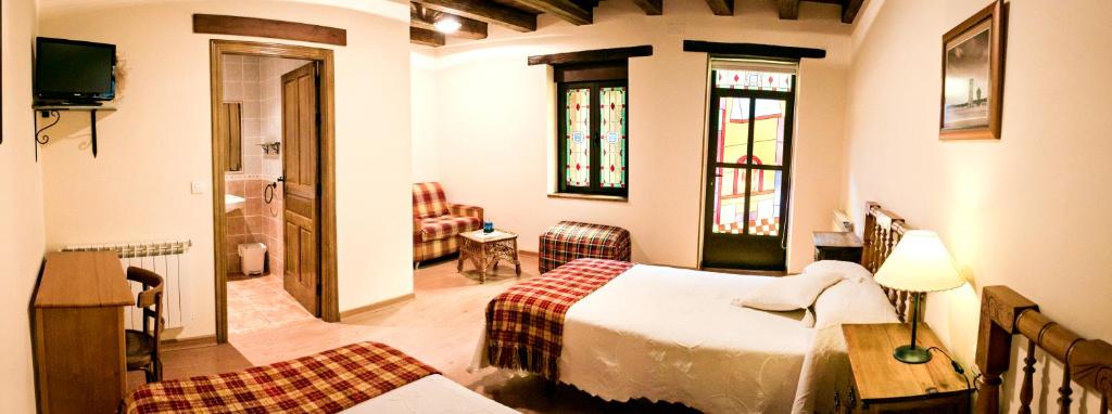 Cama o camas de una habitación en Hotel Rural El Habanero