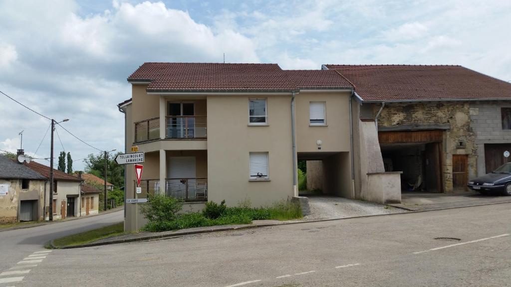 a house on the side of a street at L'appartement Du Bien être in Damblain