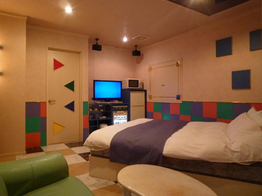 TV a/nebo společenská místnost v ubytování ホテルアテネ 市原鶴舞インター店