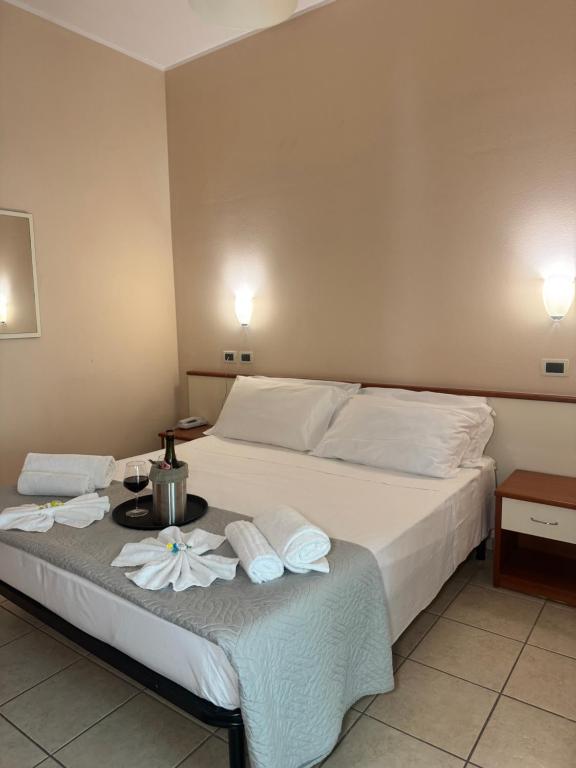 Postel nebo postele na pokoji v ubytování Blue Hotel