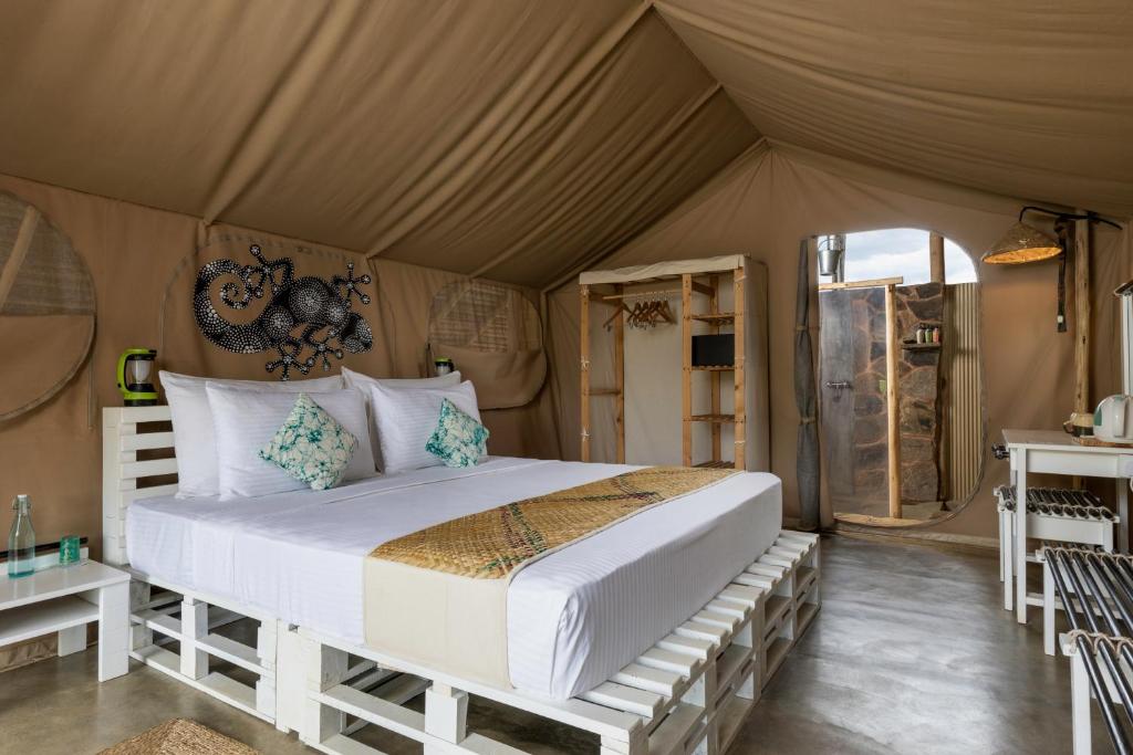 Postel nebo postele na pokoji v ubytování Wild Glamping Gal Oya - Thema Collection