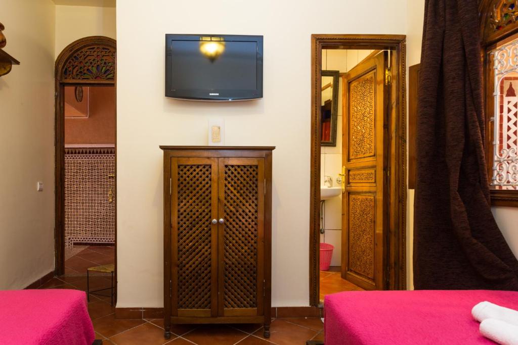 Cama o camas de una habitación en Hotel Atlas
