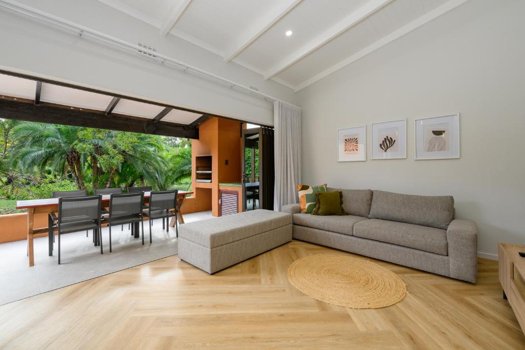 a living room with a couch and a table at San Lameer Villa 2027 - 2 Bedroom Superior - 4 pax - San Lameer Rental Agency in Southbroom
