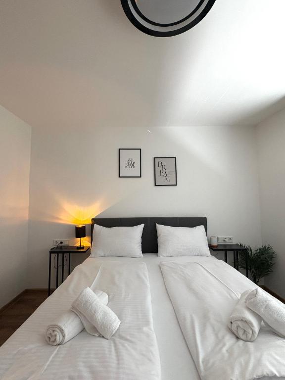 Postel nebo postele na pokoji v ubytování homy Central City Oasis in Dornbirn