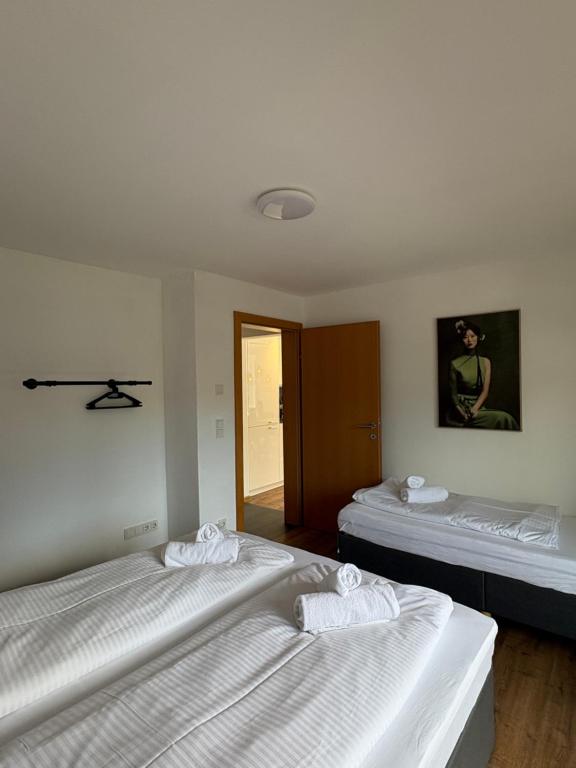 Postel nebo postele na pokoji v ubytování homy Central City Oasis in Dornbirn