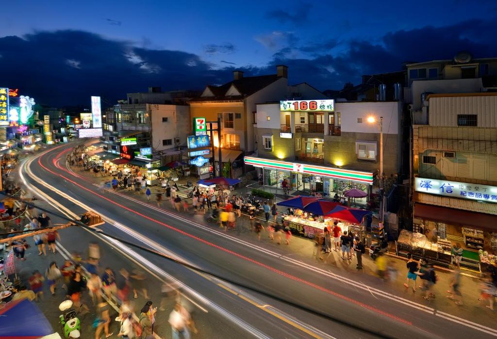 a busy street in a city at night at Kenting 166 in Kenting