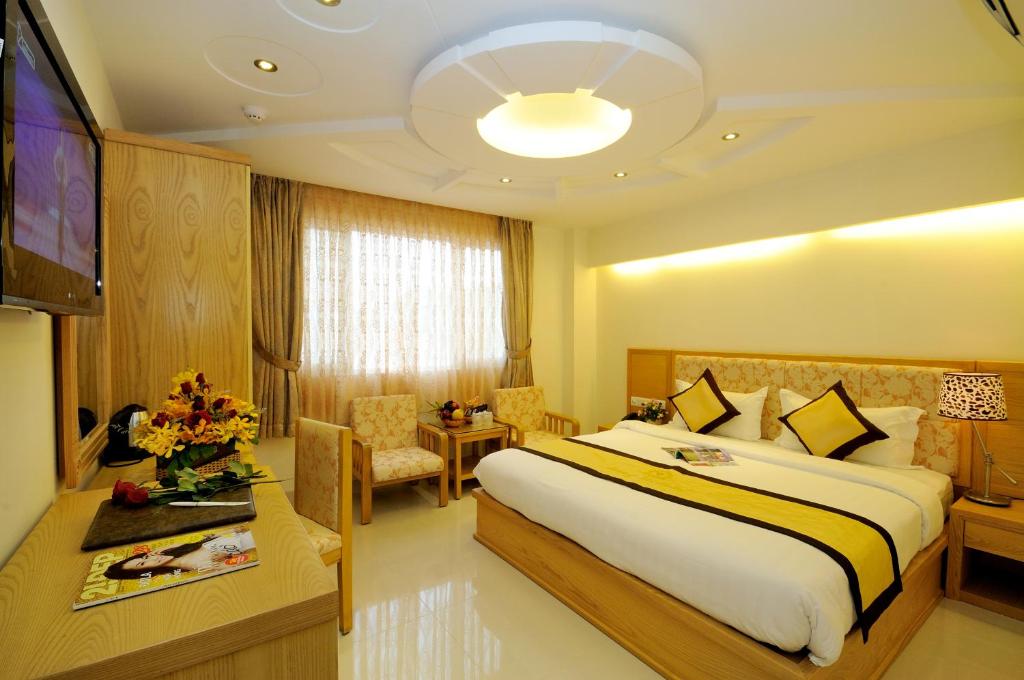 Giường trong phòng chung tại Vuong Tai Hotel