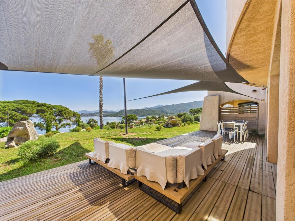 a house with a view of the ocean from a deck at Résidence Aigue Marine in Coti-Chiavari