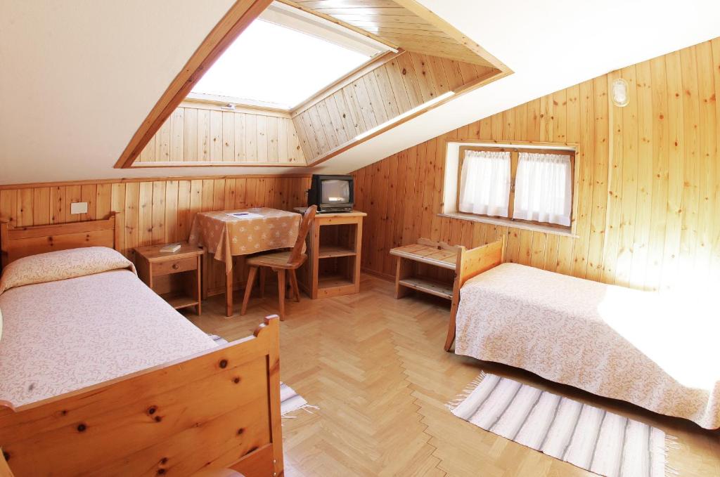 Postel nebo postele na pokoji v ubytování Hotel Vallecetta