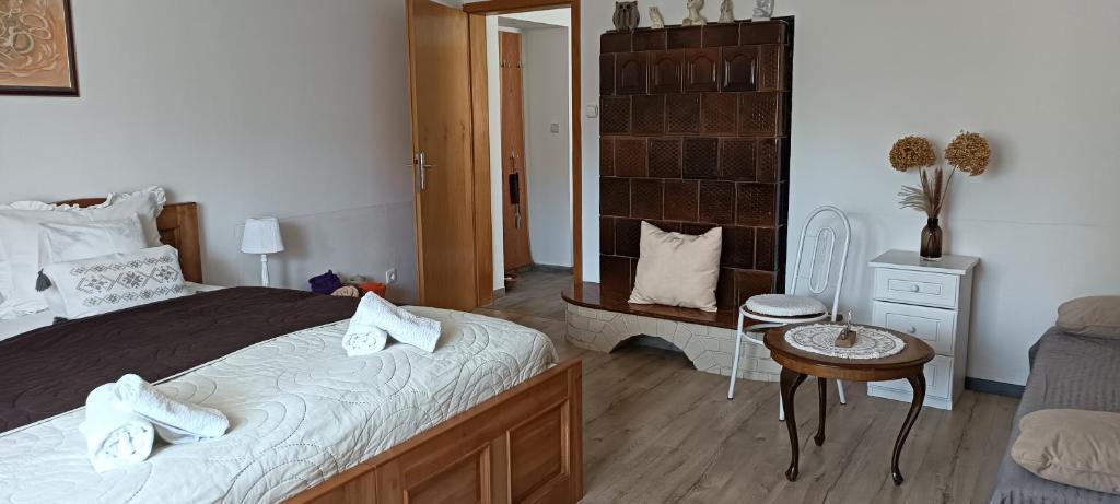Postel nebo postele na pokoji v ubytování Marianna Apartman
