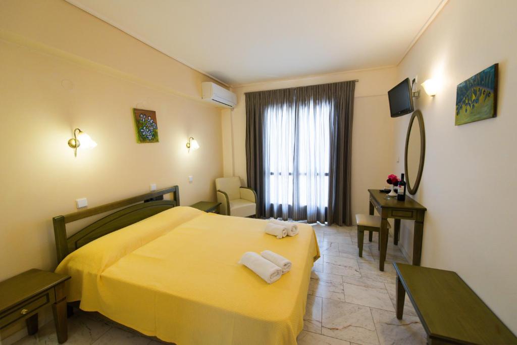 Postel nebo postele na pokoji v ubytování Hotel Niras