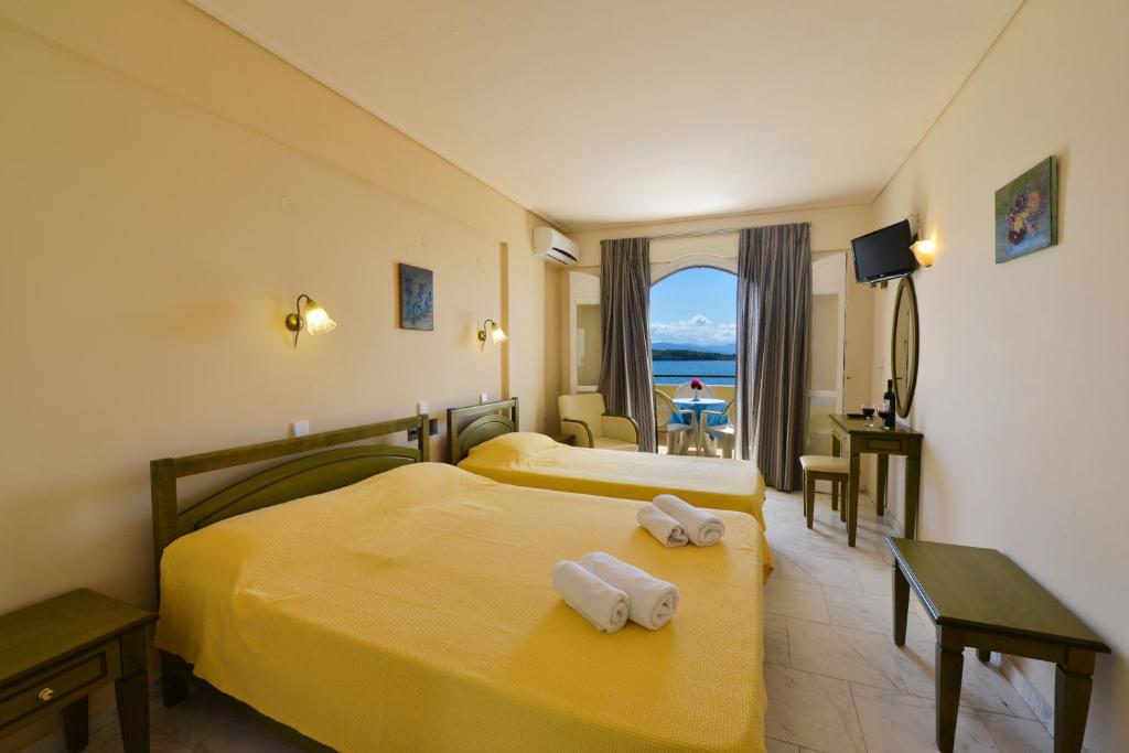 Postel nebo postele na pokoji v ubytování Hotel Niras