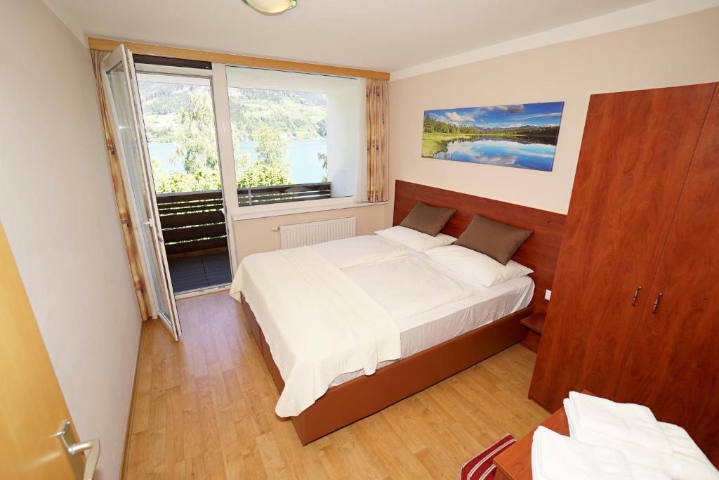 Posteľ alebo postele v izbe v ubytovaní Appartement Alpensee