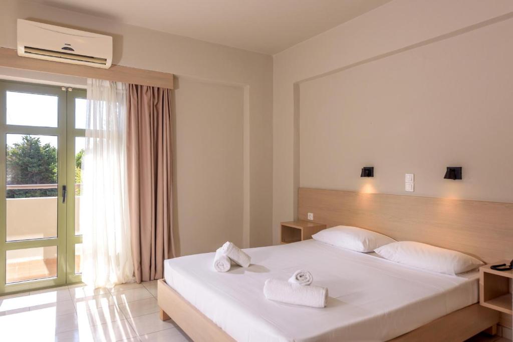Postel nebo postele na pokoji v ubytování Zeus Hotels Ydoria Resort