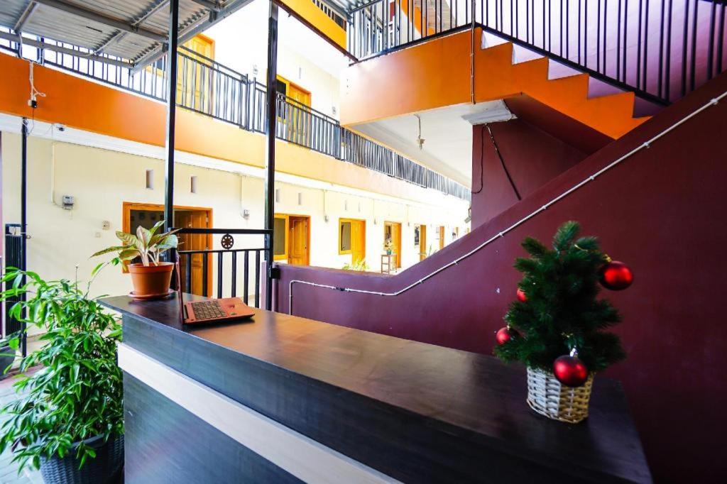 a christmas tree sitting on a table in a building at OYO 1720 A2b Residence in Malalayang