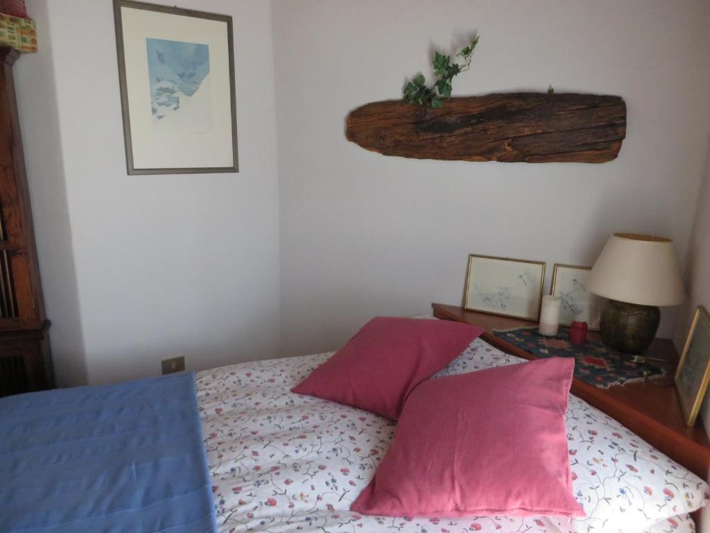 Łóżko lub łóżka w pokoju w obiekcie Casa Vacanze Roncaiola