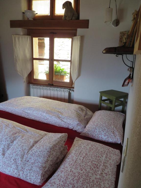 Łóżko lub łóżka w pokoju w obiekcie Casa Vacanze Roncaiola