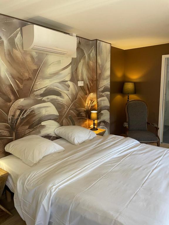 Postel nebo postele na pokoji v ubytování L auberge du Moulin Eschviller