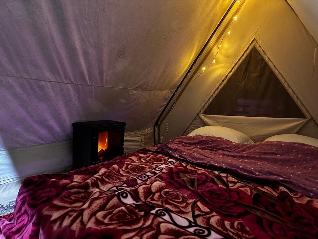 Postel nebo postele na pokoji v ubytování Camping chez julien