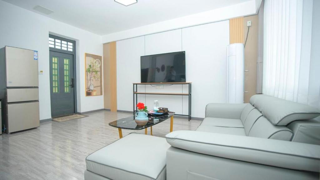 TV a/nebo společenská místnost v ubytování Beijing Great Wall Shiguang Homestay