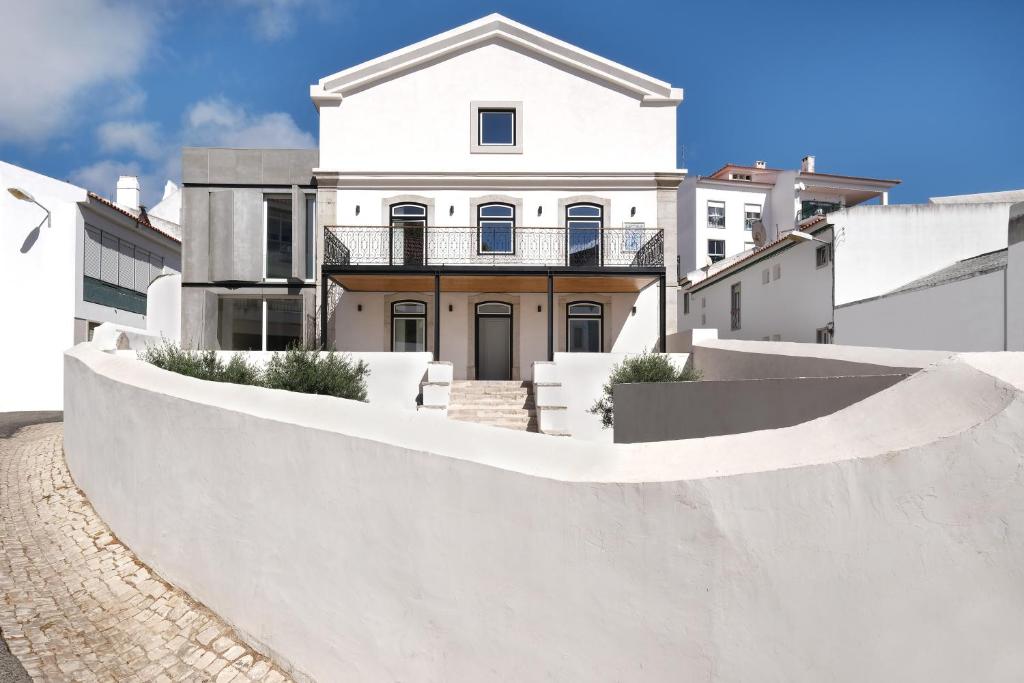 a white house with a ramp in front of it at Villa Sofia Cascais in Cascais
